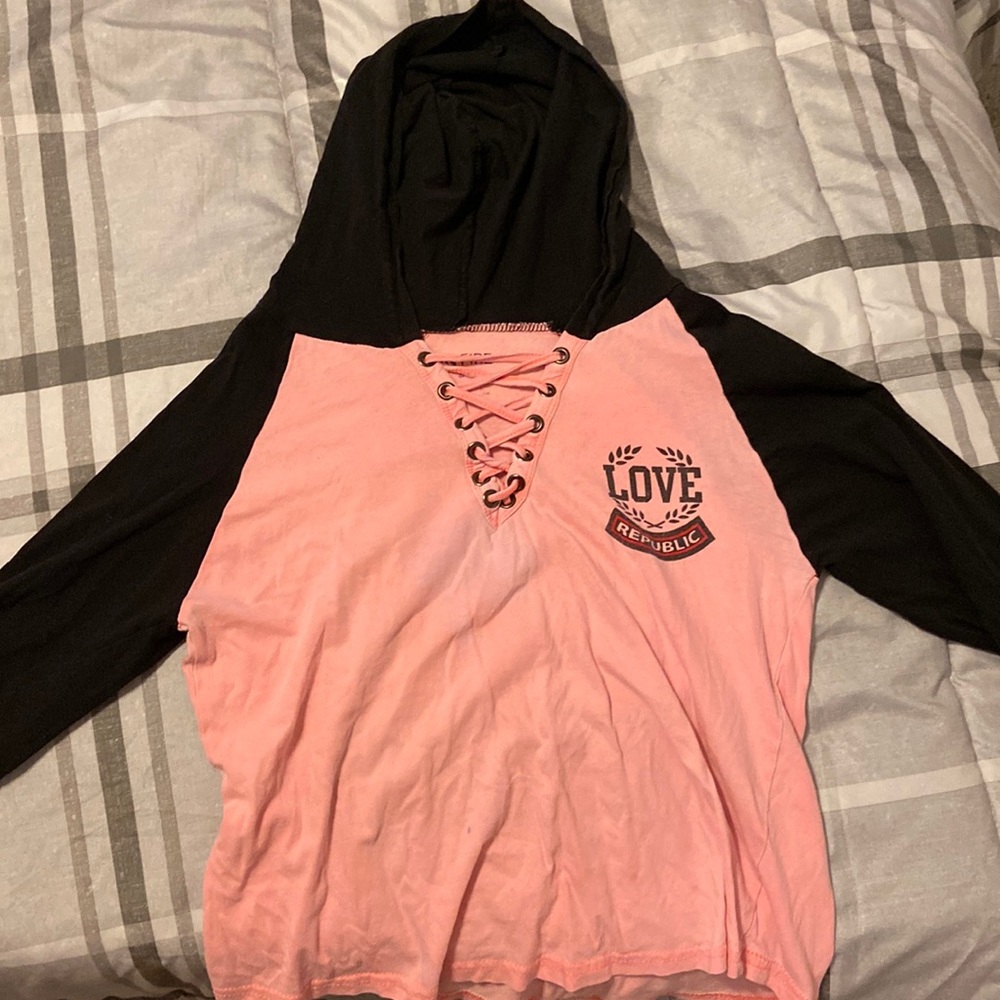 Size: small. Brand: On Fire. Pink hoodie with black sleeves and hood.